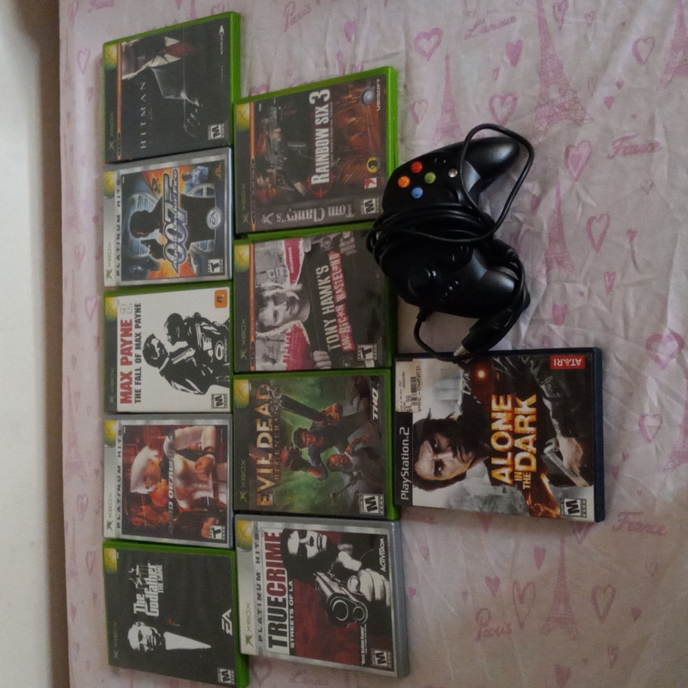 9 Xbox games and 1 play station 2 and control